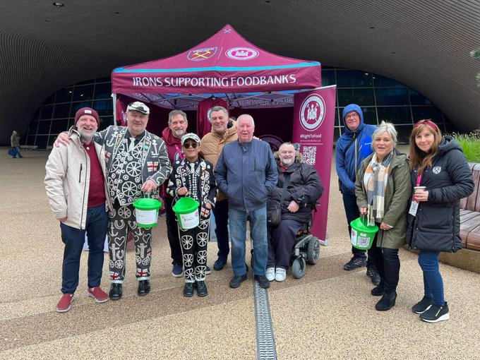 charity workers standing under a gazebo